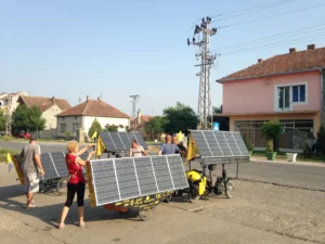 Noon charging in a Serbian village. We had to explain to the villagers that they should not stand in front of our solar panels.