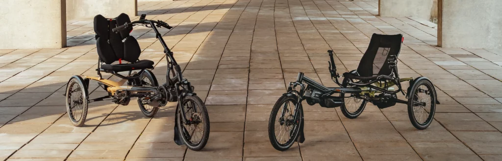 both version of the trike standing next to each other